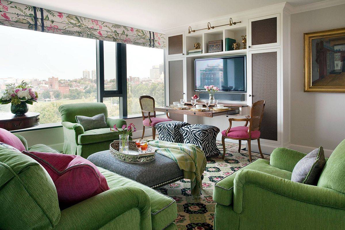 hình ảnh phòng khách với ghế sofa màu xanh lá, phòng ăn là một phần mở rộng của bếp 