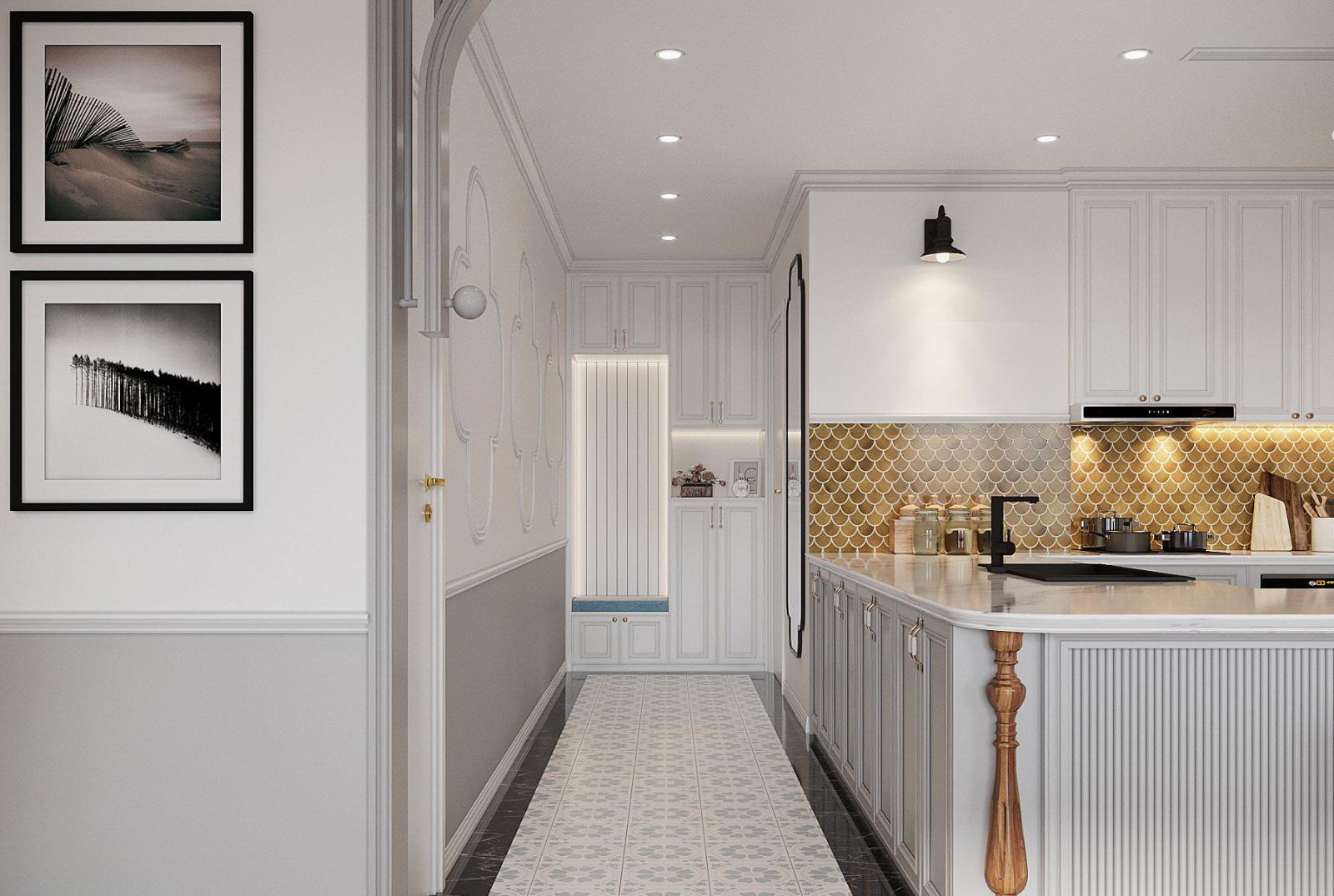 Toàn bộ khu vực lối vào dẫn thẳng vào gian bếp được thiết kế với tông màu trắng chủ đạo cùng hệ tủ lưu trữ cao kịch trần gọn đẹp.
