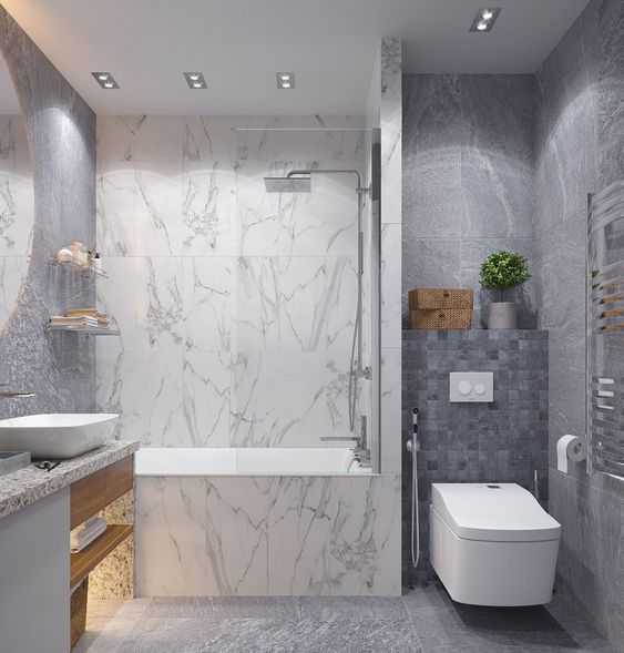 Phòng tắm, vệ sinh hiện đại trong nhà ống 2 tầng 1 tum. Tường và sàn ốp đá cẩm thạch tông màu xám - trắng sang trọng.